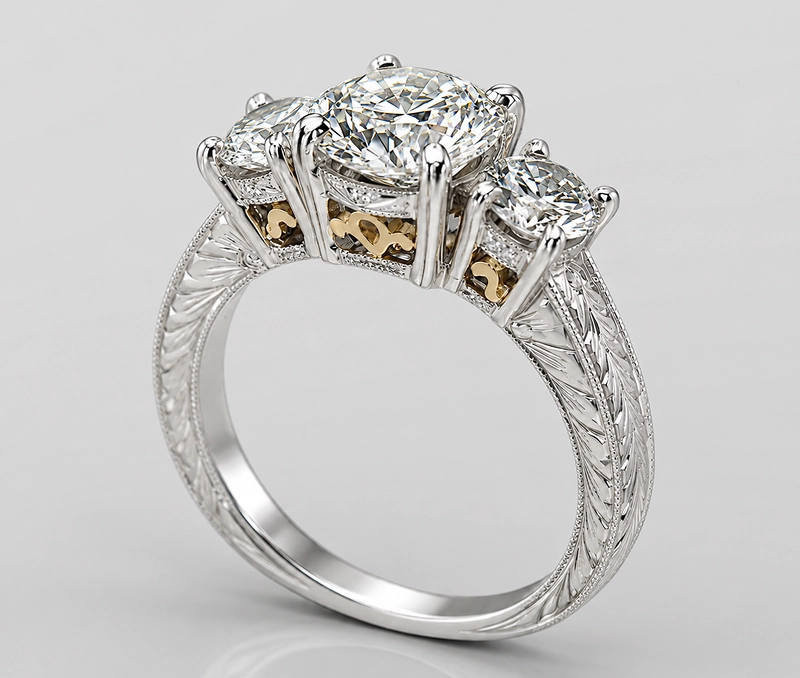 Three-stone diamond ring with intricate design.