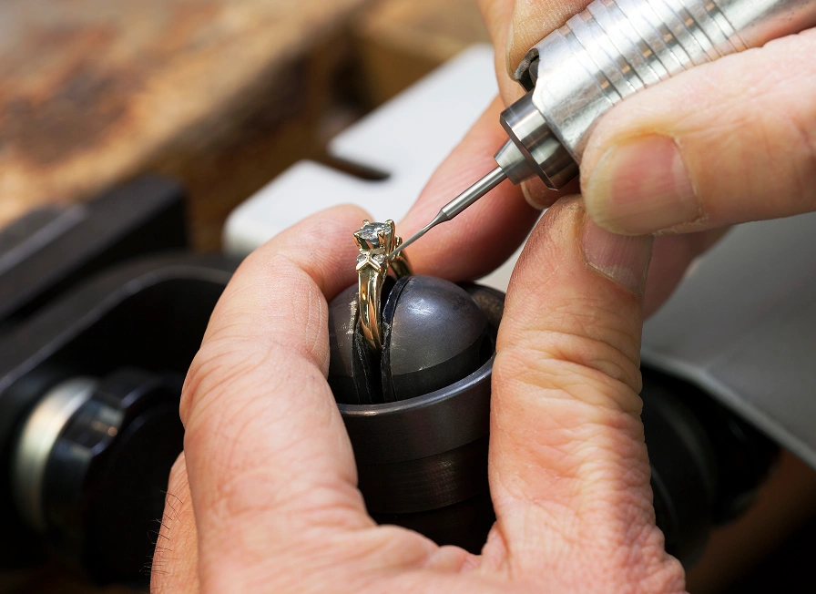 Jeweler working on a diamond ring.